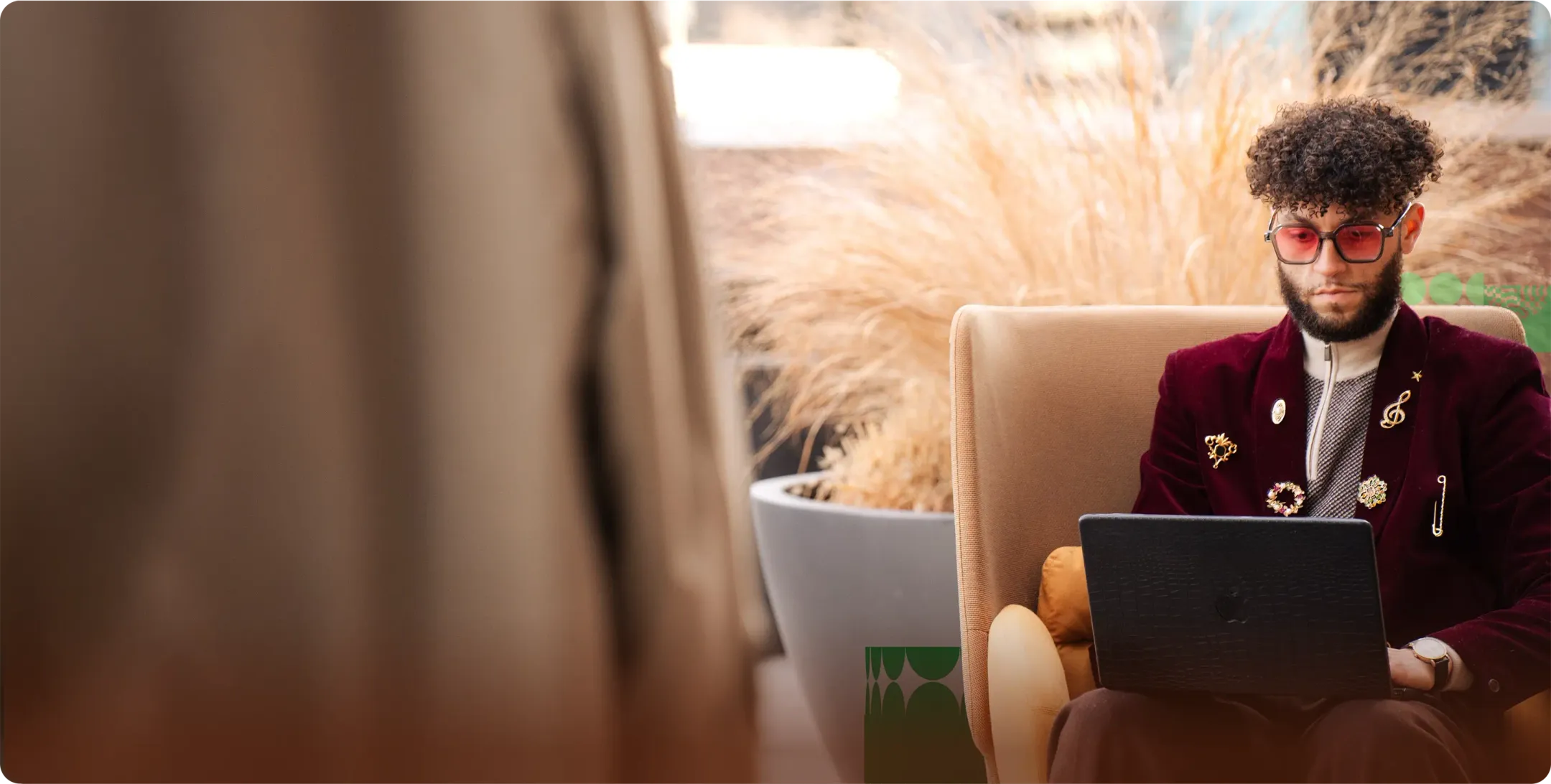 Stylist, Glenn Joseph, sorting through wardrobe with another young man.